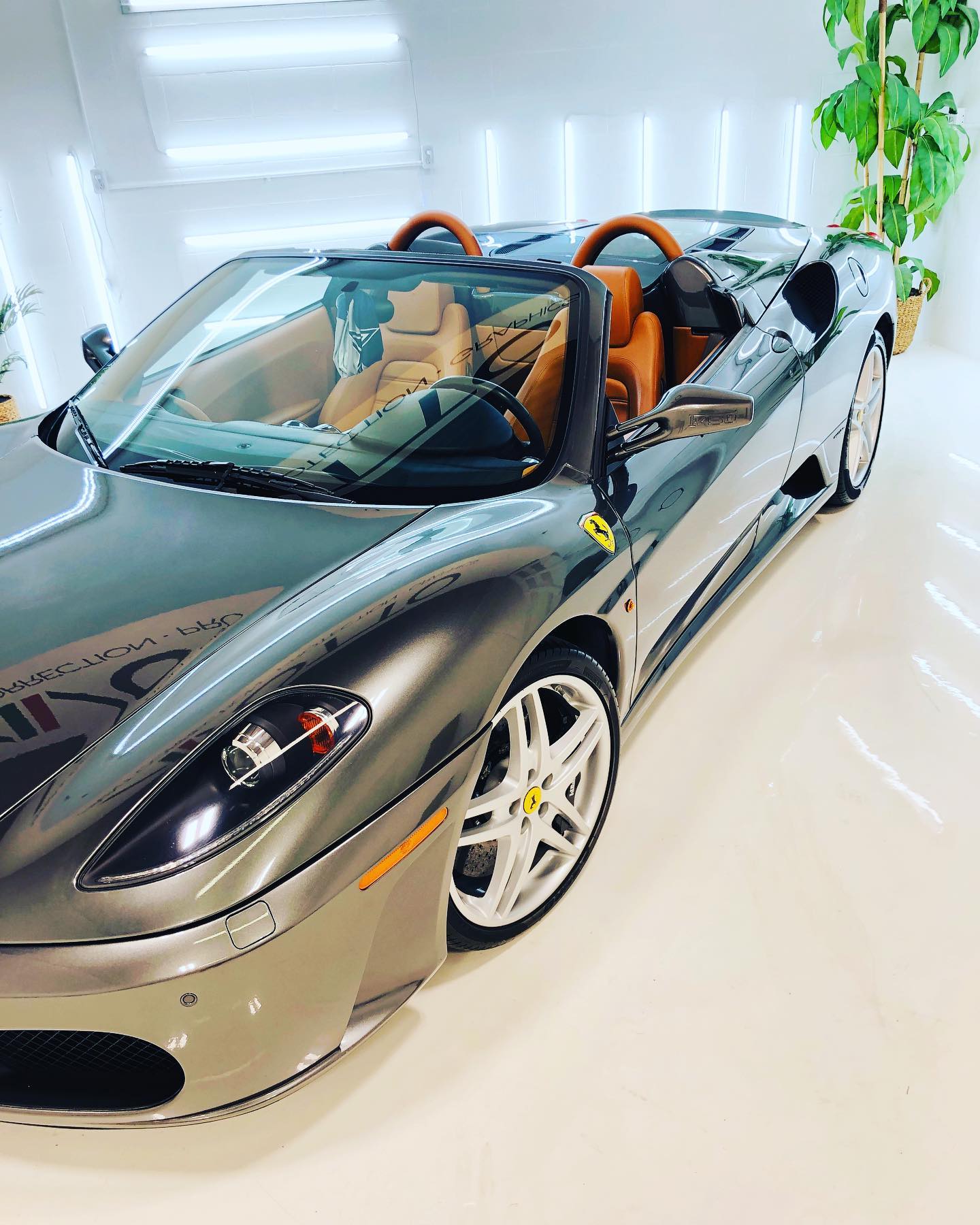 Ferrari F430 Spider after paint correction, beaded water sheeting off a freshly coated surface