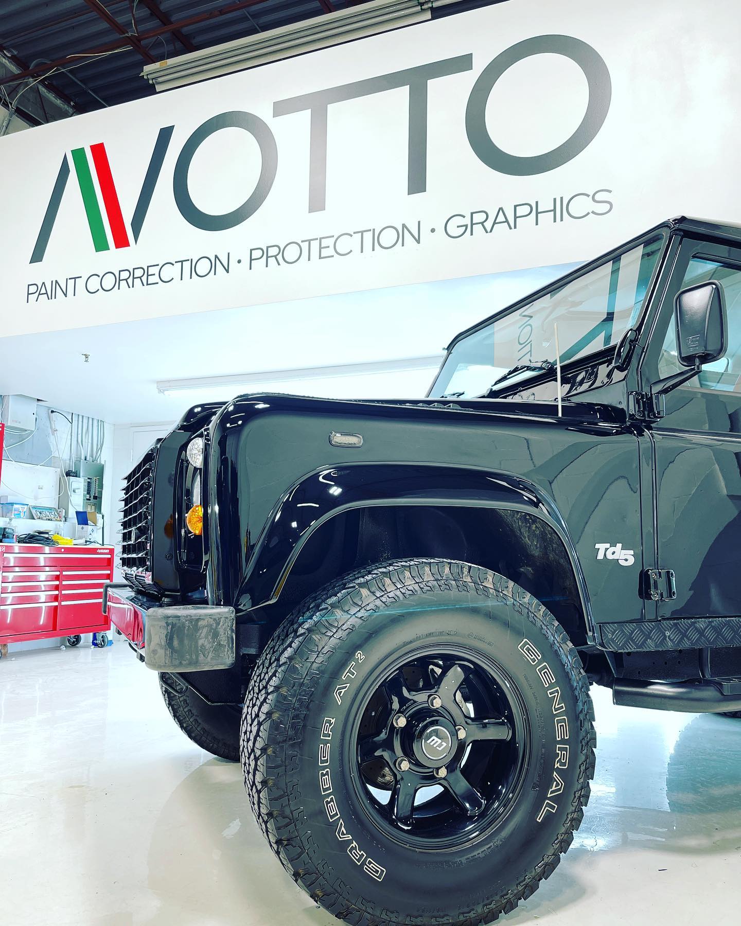 Land Rover Defender after paint correction, crisp edge lines from a precision film or coating install